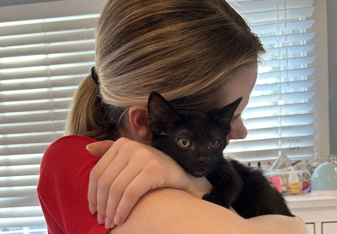 Stella Keyes and her sister Sicily volunteering with their favorite kittens!